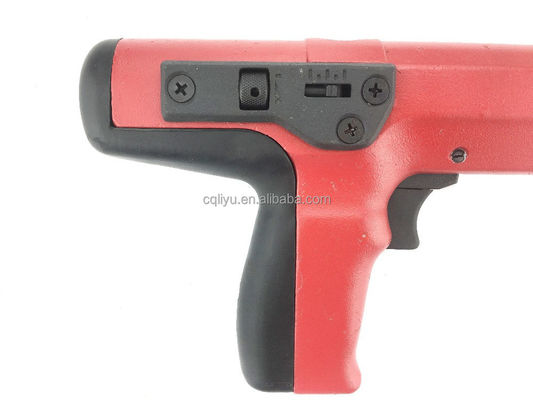 Pistola de clavos decorativa de tapicería roja con cargas de polvo de tira y clavos de hormigón duraderos